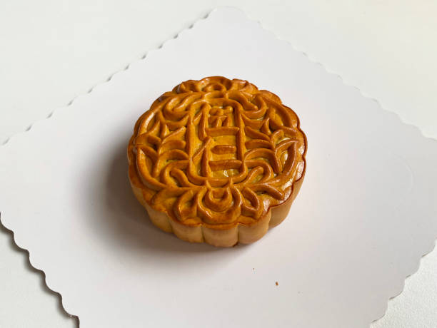 istock traditional gourmet home made baked moon cake mixed nuts lotus paste egg yolk red bean filling on white background for Chinese mid autumn festival celebration dessert pastry menu halal food in asian 2062430251