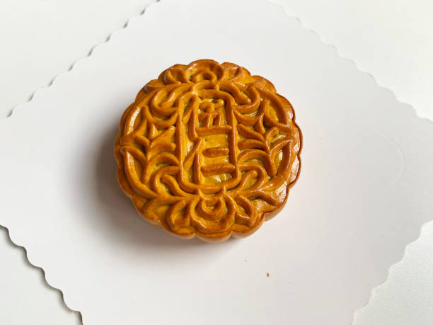 istock traditional gourmet home made baked moon cake mixed nuts lotus paste egg yolk red bean filling on white background for Chinese mid autumn festival celebration dessert pastry menu halal food in asian 2062430257