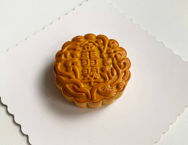 istock traditional gourmet home made baked moon cake mixed nuts lotus paste egg yolk red bean filling on white background for Chinese mid autumn festival celebration dessert pastry menu halal food in asian 2062430803
