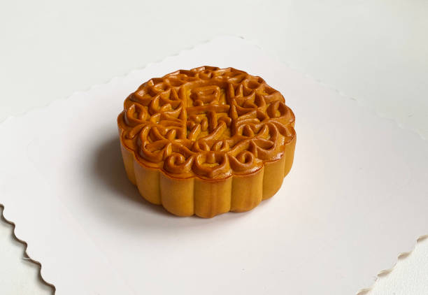 traditional gourmet home made baked moon cake mixed nuts lotus paste egg yolk durian matcha green tea green bean pandan nut wuren yam red bean filling on white background for Chinese mid autumn festival celebration dessert pastry menu halal food in asian