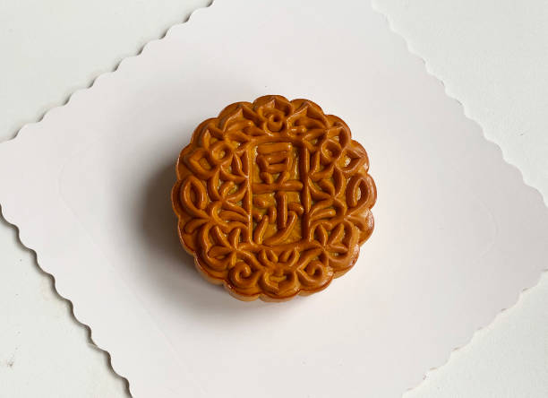 istock traditional gourmet home made baked moon cake mixed nuts lotus paste egg yolk red bean filling on white background for Chinese mid autumn festival celebration dessert pastry menu halal food in asian 2062431882