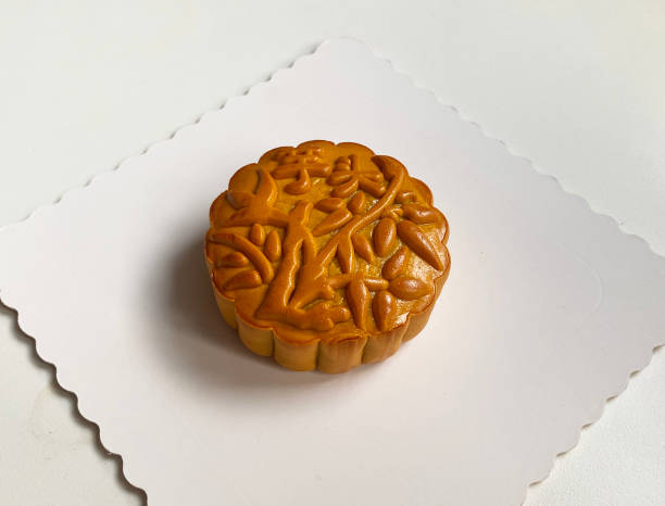 istock traditional gourmet home made baked moon cake mixed nuts lotus paste egg yolk red bean filling on white background for Chinese mid autumn festival celebration dessert pastry menu halal food in asian 2062432921