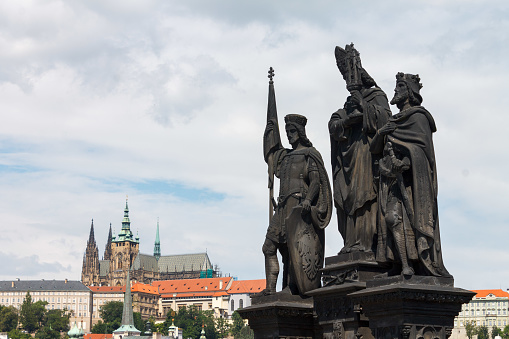 St. Norbert, St. Wenceslas and St. Sigismund statues on the famous Charles Bridge (Karluv most) and St Vitus Cathedral, Prague, Czech Republic