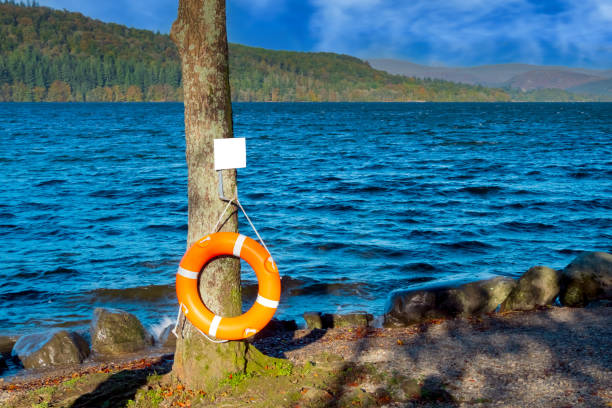 orange life belt - life jacket buoy sign sky ストックフォトと画像