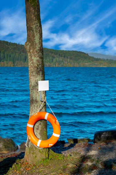 orange life belt - life jacket buoy sign sky ストックフォトと画像