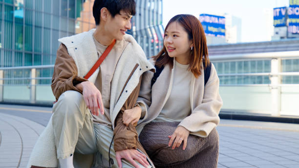 istock Two Young Japanese Parents Squatted on the Bridge 2062464351