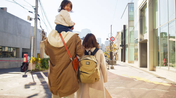 istock Cute Japanese Toddler Looking back while Sitting on Father's Shoulders 2062464372