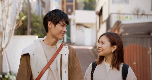 istock Young Japanese Couple Looking at Each Other 2062465458
