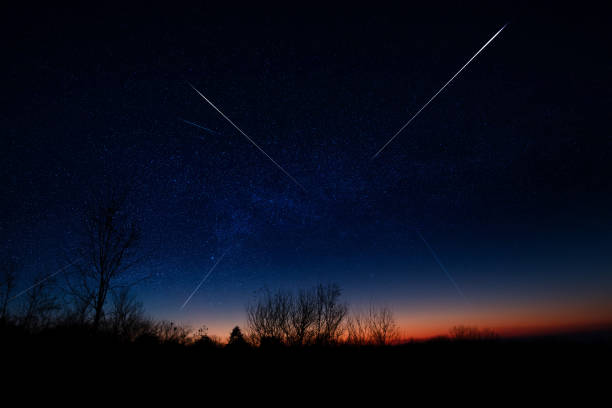 istock Shooting star, Milky way and landscape silhouettes. 2062477138