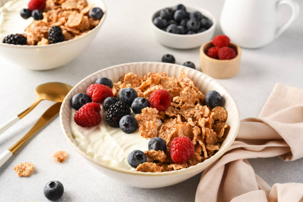 Breakfast with yogurt cereals and berries.