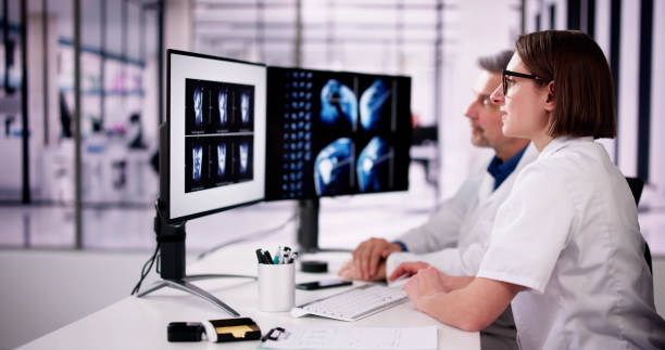 istock Surgeon Doctor Looking At Knee Xray Bone Scan 2062497199