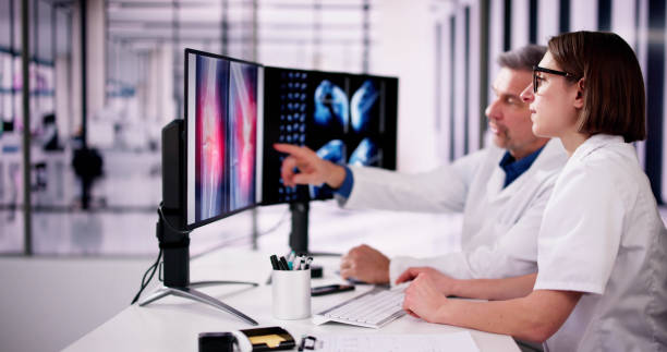 istock Surgeon Doctor Looking At Knee Xray Bone Scan 2062497203
