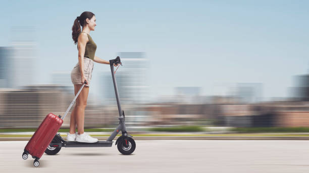 istock Woman riding an electric scooter 2062511441