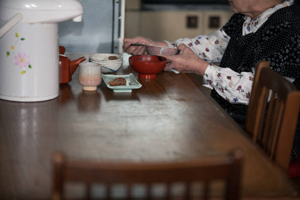 istock Elderly japanese woman eating lonely 2062517200