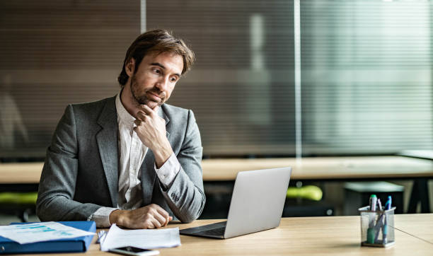 istock Young businessman brainstorming while working on a computer in the office. 2062527765