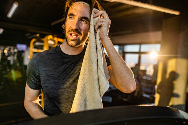 istock Athletic man feeling tired on sports training in a gym. 2062532480