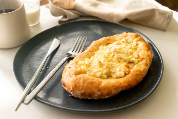 istock traditional Georgian cuisine.  Open pie with mozzarella cheese. Ajara khachapuri 2062546751