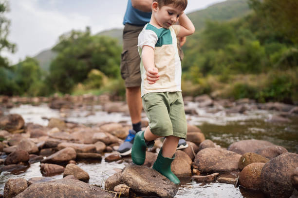 istock Father and son enjoying a carefree spring day in nature 2062553792