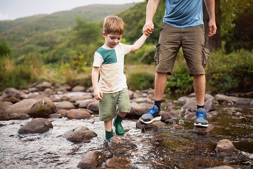 Father and son enjoying a carefree spring day in nature.