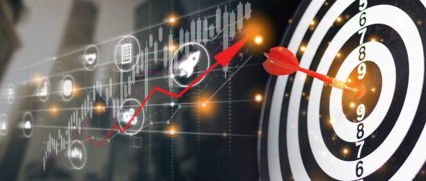 istock Businessman throwing red arrow dart to  target dart board. Setup objectives and target for business investment concept. business investment objective concept Marketing strategies and goals for success 2062555419