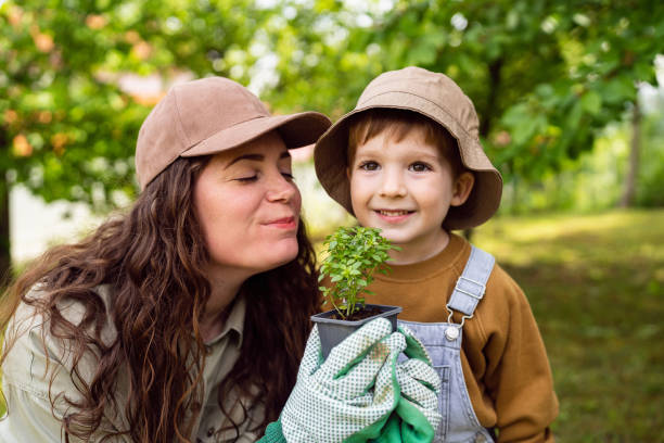 Mother and son gardening together.