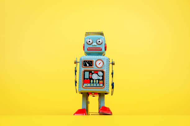 istock Retro tin robot, tin robot on yellow background. 2062568396