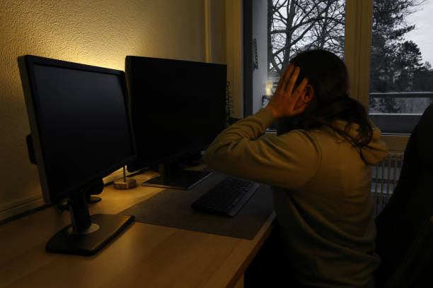 istock Stressed woman in pullover working in home office at night 2062579232