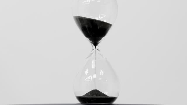 The hourglass counts the flowing sand. End of the countdown timer. Time is over.