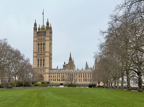 London, UK - March 4, 2024: The Houses of Parliament seen from Victoria Tower Gardens South, London, UK.