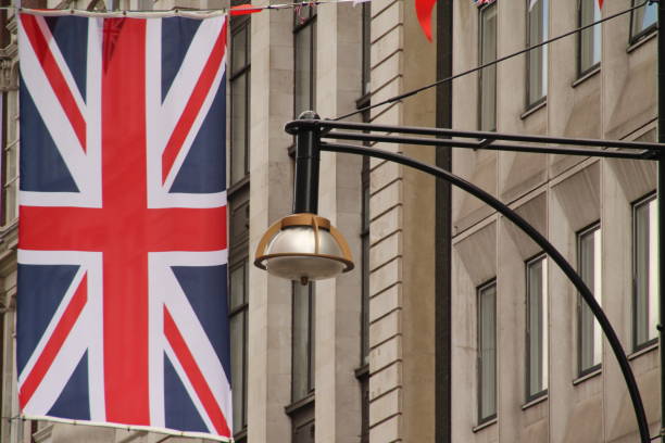 A Union Jack flag displayed in an urban setting for an event