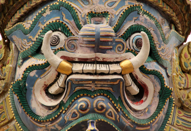 An Asian-style painted face statue with intricate design