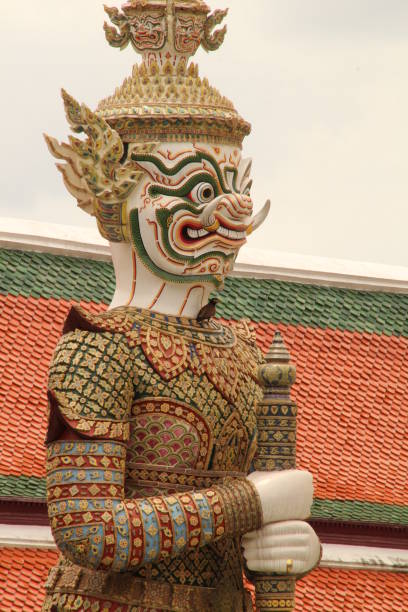 An Asian-style painted face statue with intricate design