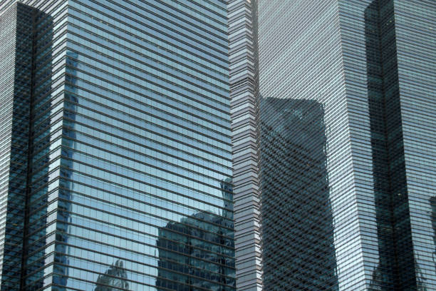 Some buildings reflecting in darkness, creating a mesmerizing scene in Singapore