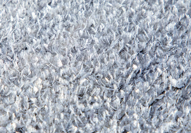 A close-up with ice crystals on the surface of the snow layer
