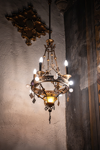 Detail of an old ornamental lamp hanging from the ceiling of the church of Llivia or Livia