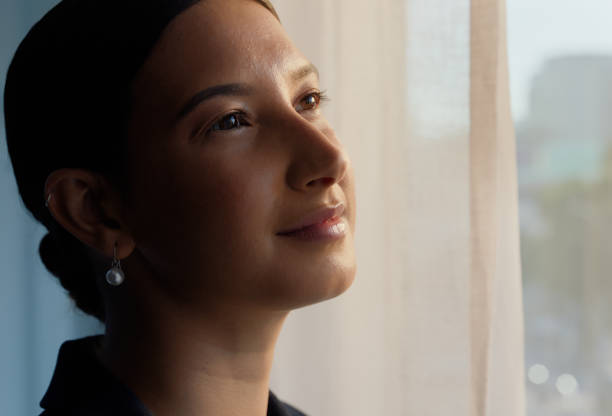 istock Thinking, face and woman in a house with memory, nostalgia or reflection with vision, hope or insight. Profile, smile and female person at home with calm morning, peaceful or enjoying a quiet moment 2062730941
