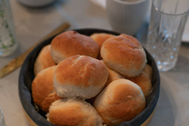 istock Authentic home made pastry buns made for birthday guests served in modern breadbasket 2062734158
