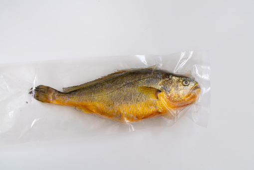 Yellow Croaker Fish isolated on a white background