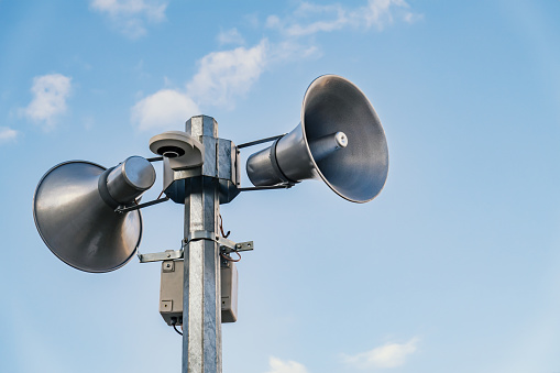 Loudspeakers on pole, broadcasting sound equipment photo