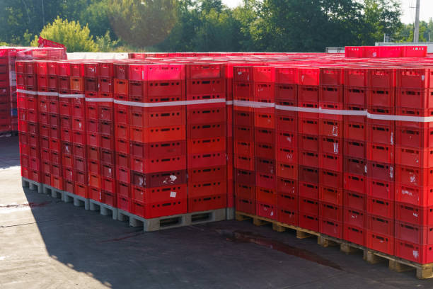 istock Large stack of red plastic boxes in the parking lot 2062754018