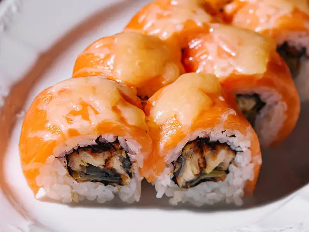 Photo of Salmon Fried sushi roll with eel and cheese