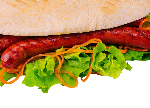 Hot dog - sandwich with sausage in pita