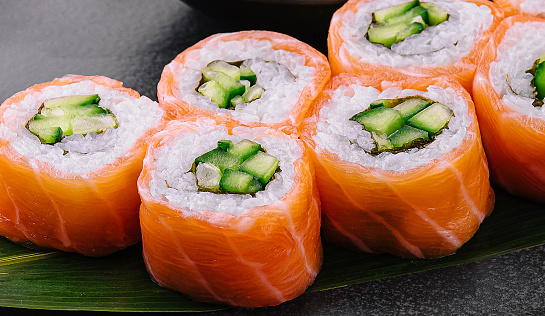 Philadelphia salmon sushi with cucumber inside on plate