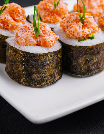 Sushi roll with salmon and caviar