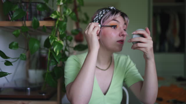 Young Woman vlogging about makeup at home