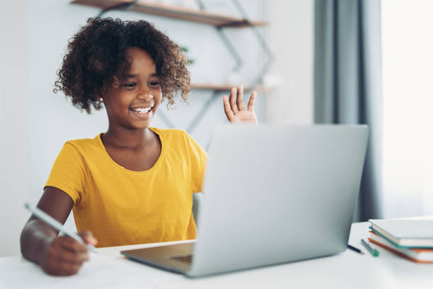 istock Smiling girl using laptop for a video call 2062787402