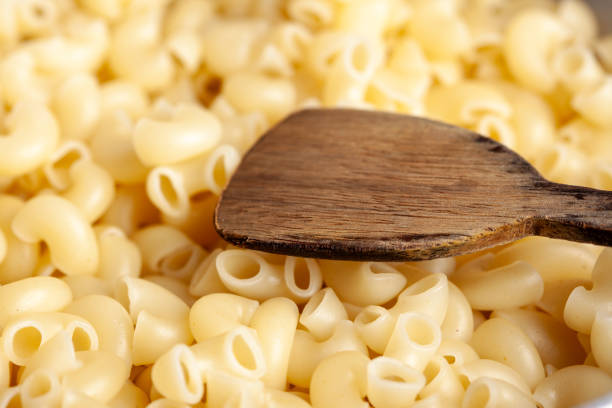 istock Close-up of uncooked elbow macaroni pasta with selective focus 2062791606