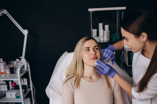 istock Lip Augmentation. Woman Getting Beauty Injection For Lips. 2062794780