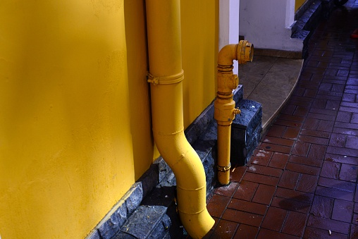 yellow wall and water pipe - horizontal