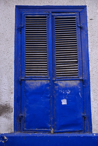a blue window shutter